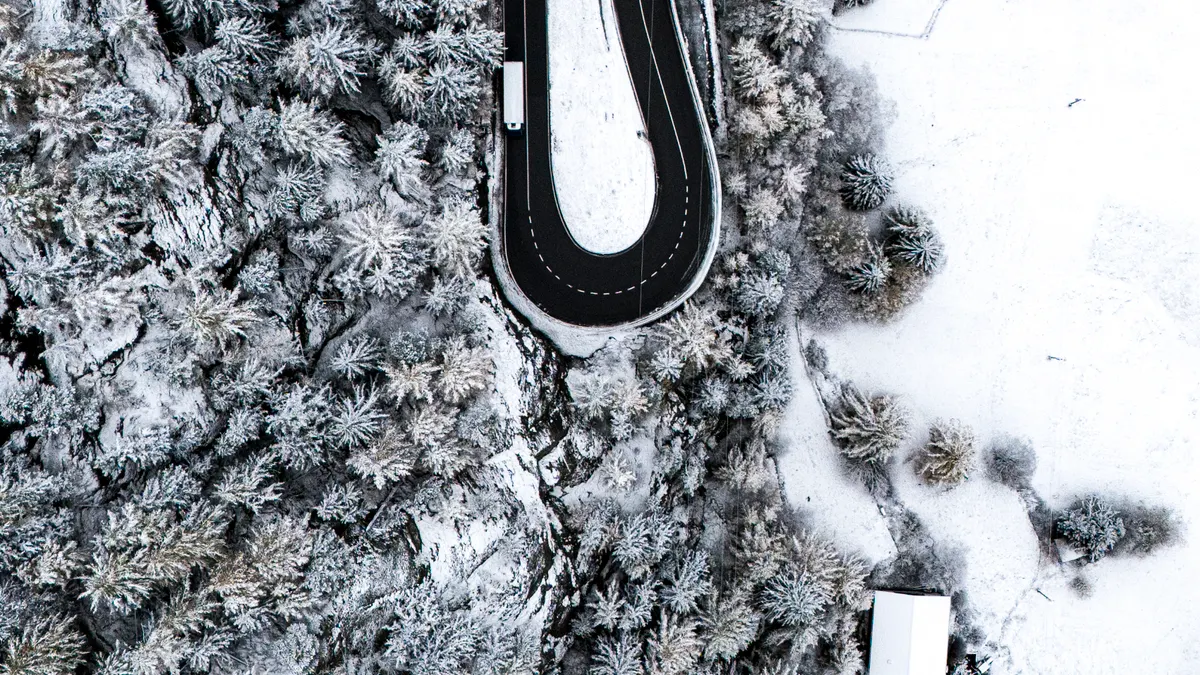 How to Build a Daily SaaS News Roundup That Readers Actually Return For — Aerial Winter View of Saas-Fee Road