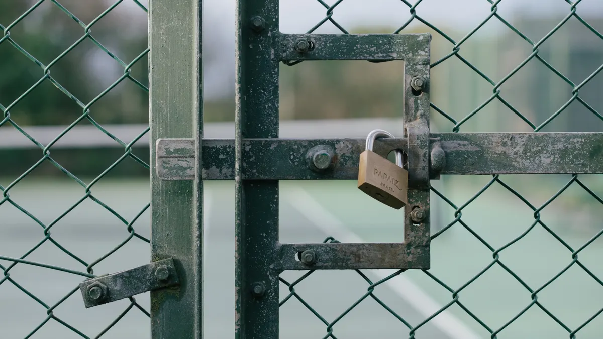 How to Tell Whether a SaaS Feature Is Public, Private Beta, or Invite-Only Padlock on a chain-link gate