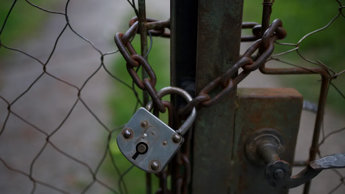 How to Tell Whether a SaaS Feature Is Public, Private Beta, or Invite-Only Padlock chained to a gate