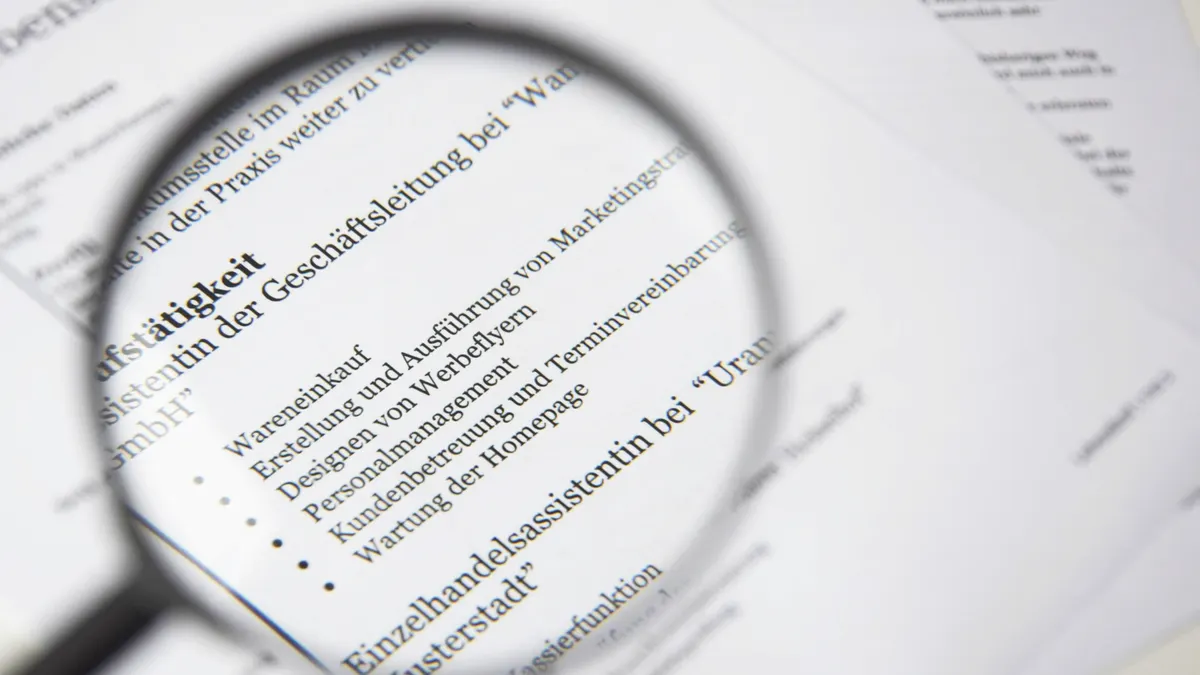 Magnifying glass over a printed document page