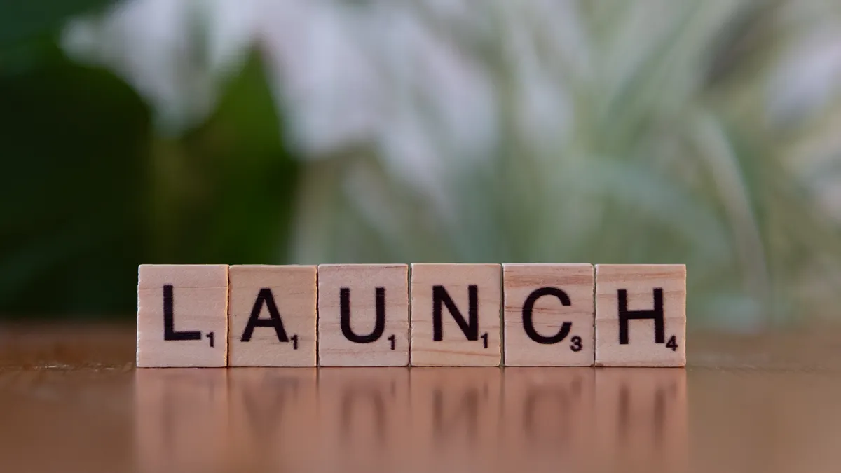 What Counts as SaaS News? A Practical Definition for Readers and Editors — Scrabble Tiles Spelling 'Launch' on Wooden Su